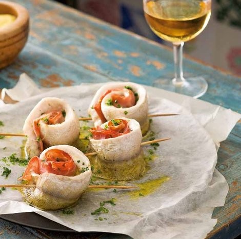 Baked whiting with jamón and garlic mayonnaise (Pescadilla)