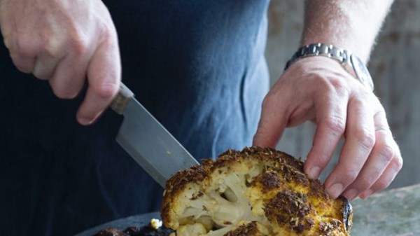 Baked whole cauliflower with Indian spices, mint and yoghurt