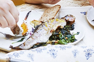Baked whole trout stuffed with spinach & pine nuts