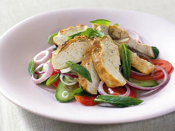 Baked yogurt chicken with tomato, mint & cucumber salad