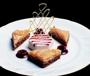 Baklava with mascarpone Bavarian and cherry sauce
