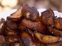 Balsamic-baked onions and potatoes with roast pork