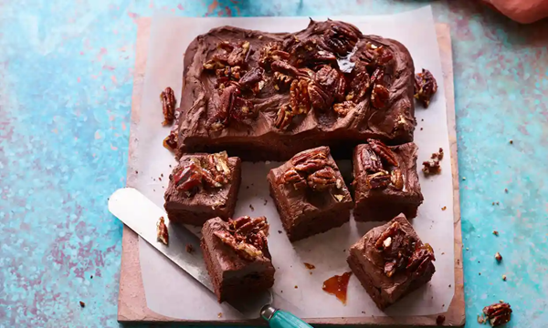 Banana cocoa cake with whipped ganache and pecan brittle
