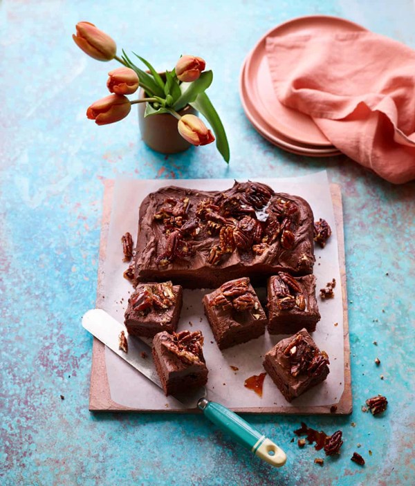 Banana coconut cake with whipped ganache and pecan brittle