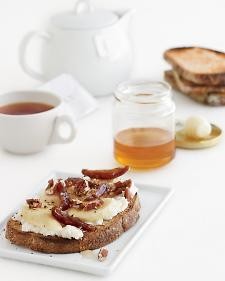 Banana-ricotta toasts with pecans, dates, and honey