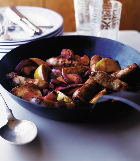 Bangers and mash with mustard gravy and apple wedges