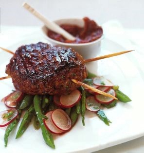 Barbecue pork-belly burger with sticky herb baste, ginger-plum relish, and pea and radish salad