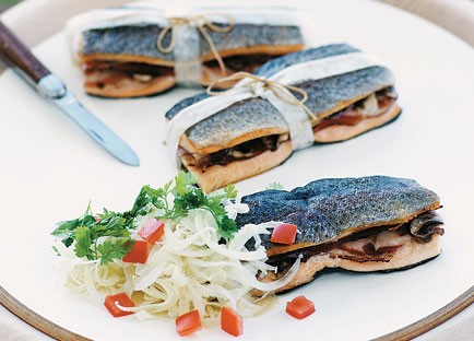 Barbecue trout bundles with prosciutto and button mushrooms