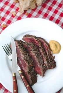 Barbecued bavette steak with anchovies, red wine and garlic