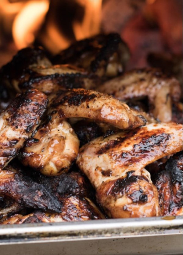 Barbecued chicken wings marinated in sticky spicy soy sauce