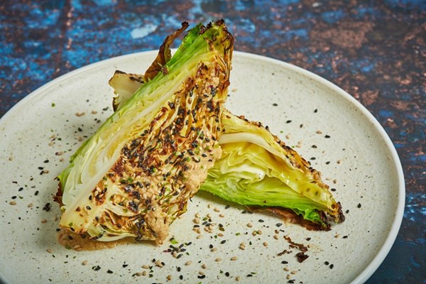 Barbecued hispi cabbage with miso butter and goma dressing