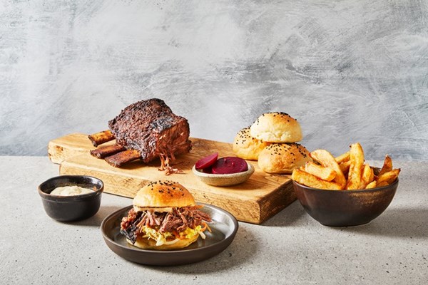 Barbecued Jacob’s ladder with kimchi slaw, milk buns, pickled beets, chips and horseradish hollandaise