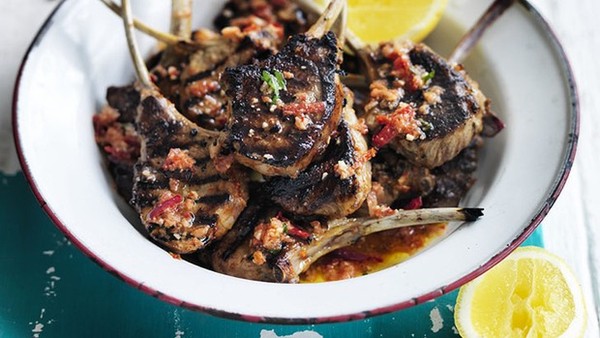 Barbecued lamb cutlets with tomato, almond and chilli salsa