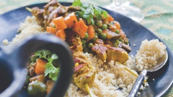 Barbecued lamb kebabs with quick vegetable stew on couscous
