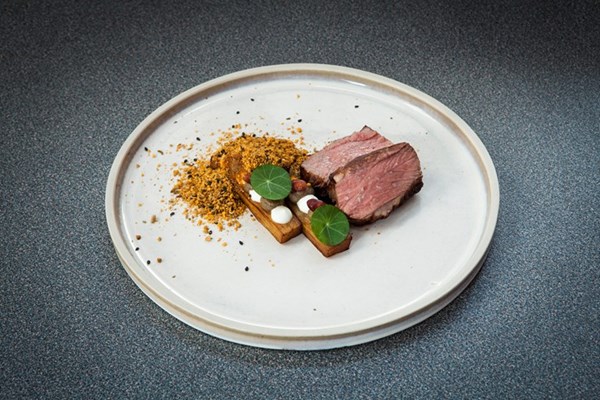  Barbecued lamb rump with smoked crème fraiche, aubergine, dukkah and pomegranate