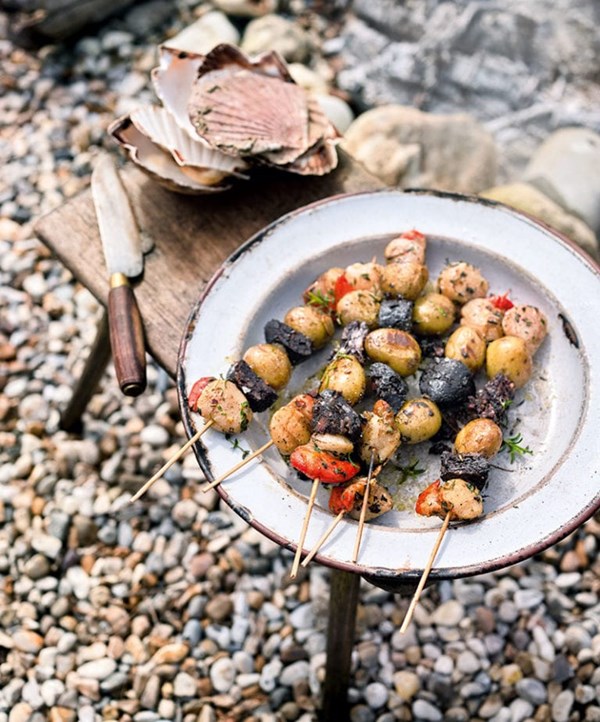 Barbecued new potato, morcilla and scallop kebabs