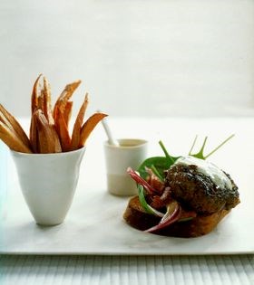 Barbecued oyster burger with blue-cheese sauce, and bacon, spinach and red onion salad
