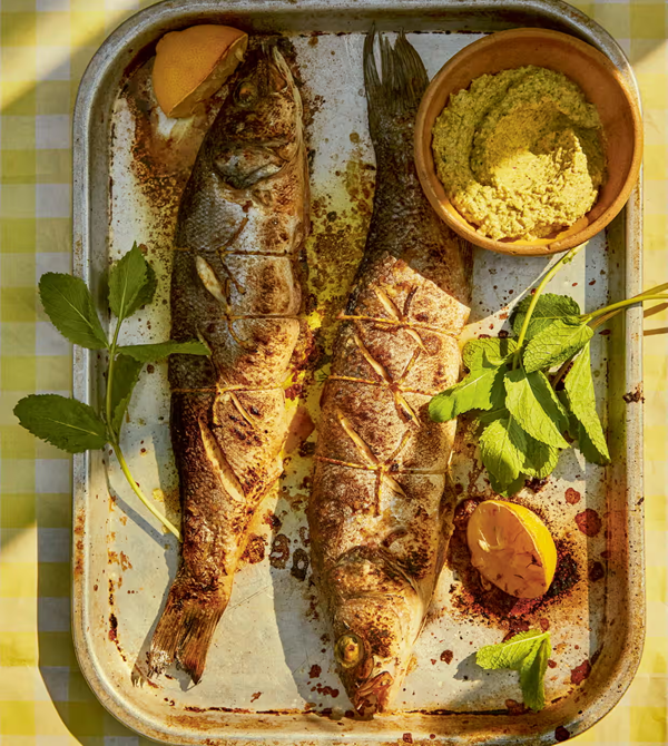 Barbecued sea bass stuffed with pistachio and caper pesto