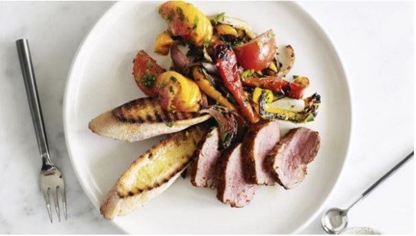 Barbecued spiced pork with capsicum, onion and tomato salad