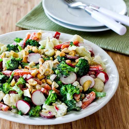Barely blanched broccoli and cauliflower salad with red bell pepper, radishes, red onion, and cashews