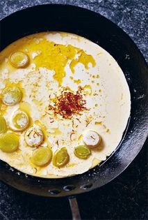 Barely cooked oysters with saffron and vermouth cream
