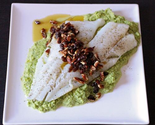 Barramundi with pecan-raisin salsa over broccoli