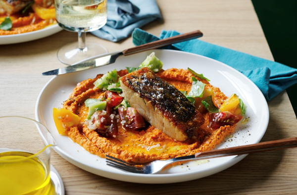 Barramundi with sauce romesco and heirloom tomato