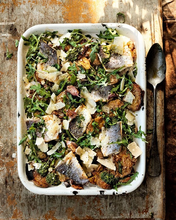 Bashed roast new potatoes with roast sea bass fillet, pesto, rocket and shaved pecorino 