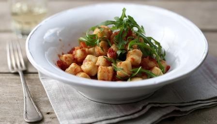 Basil gnocchi with simple tomato sauce and wild rocket