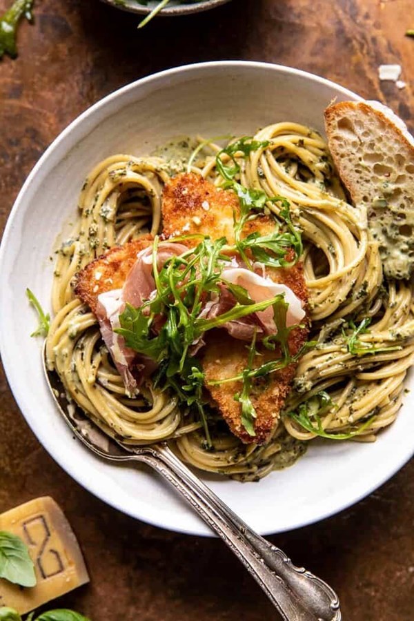 Basil Parmesan pasta with crispy chicken, prosciutto, and arugula