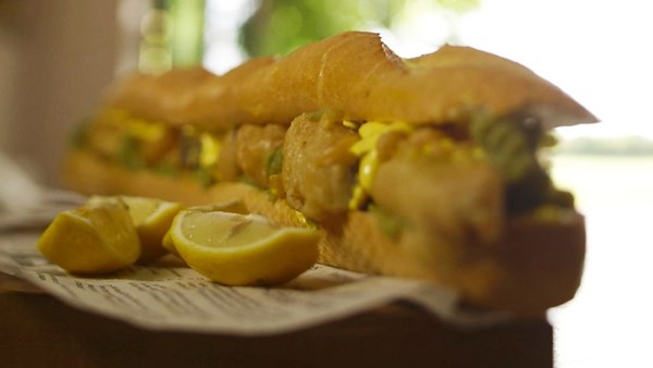 Battered pollock, mushy peas and lemon mayo baguette