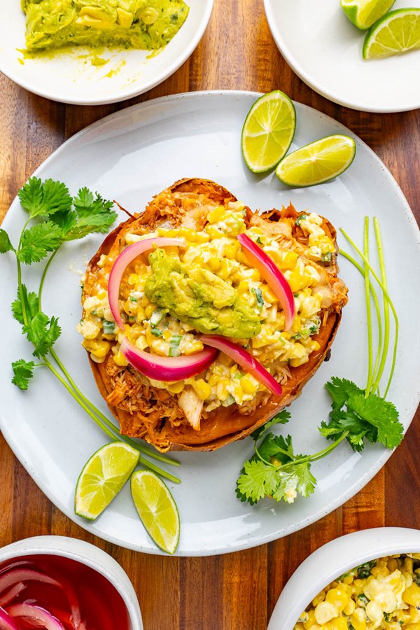 BBQ chicken and Mexican street corn salad stuffed sweet potatoes
