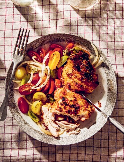 BBQ piri piri chicken thighs with tomato and onion salad
