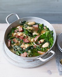 Bean-sausage soup with sautéed spring greens