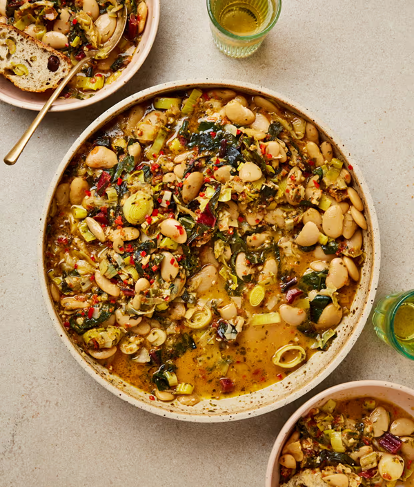 Beans and greens with tomato and cashew pesto