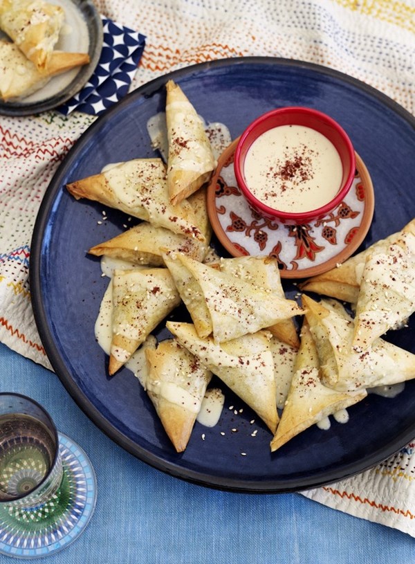 Beef and spinach filo triangles with tahini sauce and sumac