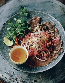Beef carpaccio with red onion and herb salad
