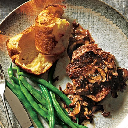 Beef filets with mushroom sauce and Parmesan popovers