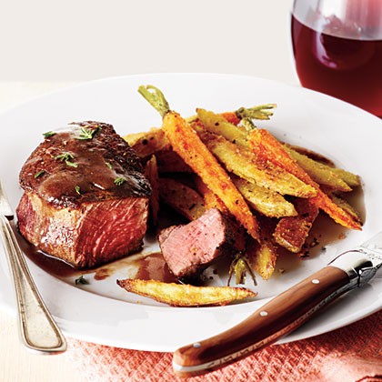Beef filets with red wine sauce and roasted veggie fries