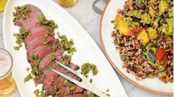 Beef fillet with green olive tapenade, pilaf and roasted vegetables