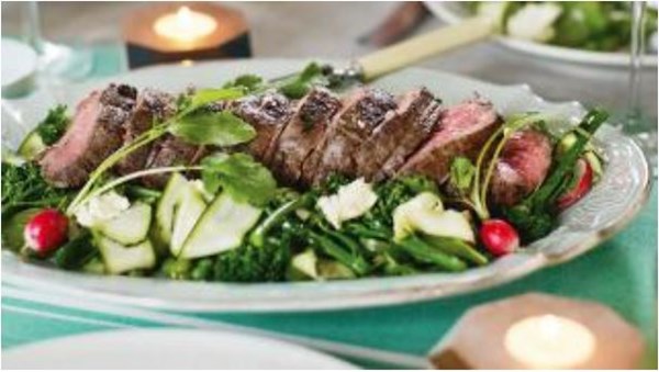 Beef fillet with shaved spring vegetable salad, ricotta and mint dressing
