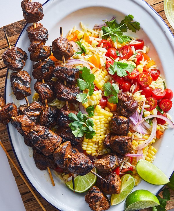 Beef kabobs with corn and orzo salad