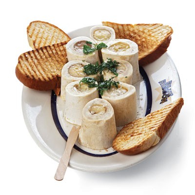 Beef marrow bones with fried parsley 