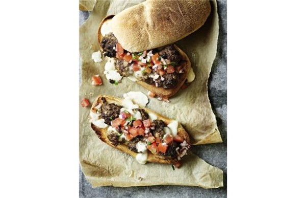 Beef meatball sandwich with melting mozzarella and tomato salsa