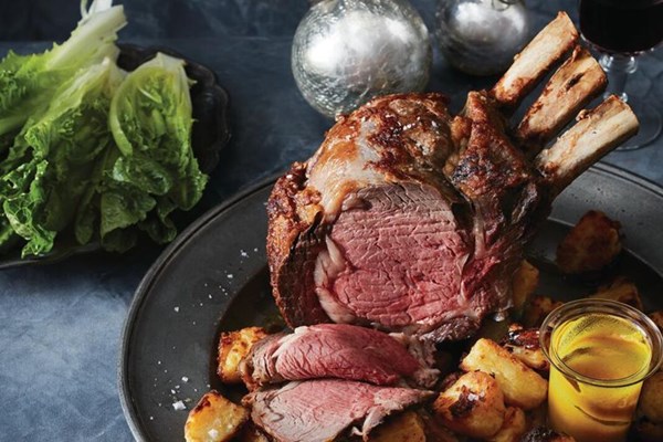 Beef rib roast, roasted potatoes and lettuce with creme fraiche dressing