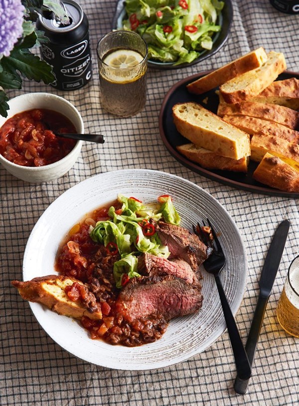 Beef, slow tomatoes and beans with pickled lettuce and cornbread