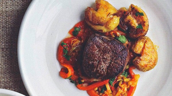 Beef steaks with tomato sauce