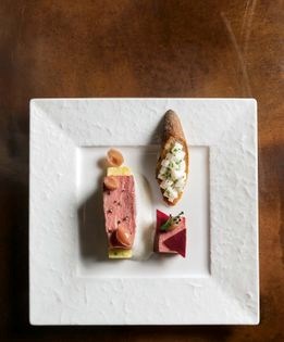 Beef tenderloin "à la ficelle" with roasted beets, bone marrow crouton, and horseradish sauce