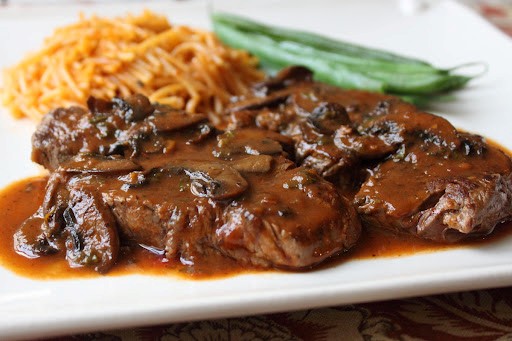Beef tenderloin medallions with caramelized tomato mushroom pan sauce