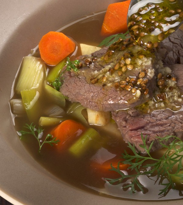 Beef tenderloin poached in beef stock with root vegetables 